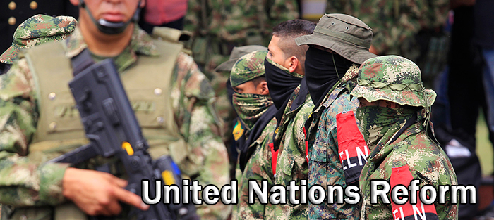 Defected members (with armbands) of Colombian guerrilla group ELN fall in at a military base during their surrender and the handover of their weapons, in Cali July 16, 2013. Authorities said 30 rebels from Colombia's second-biggest guerrilla group, the National Liberation Army (ELN), demobilized on Tuesday in El Tambo municipality in Cauca due to military pressure in the area. REUTERS/Jaime Saldarriaga  (COLOMBIA - Tags: POLITICS MILITARY CIVIL UNREST) - RTX11OU5